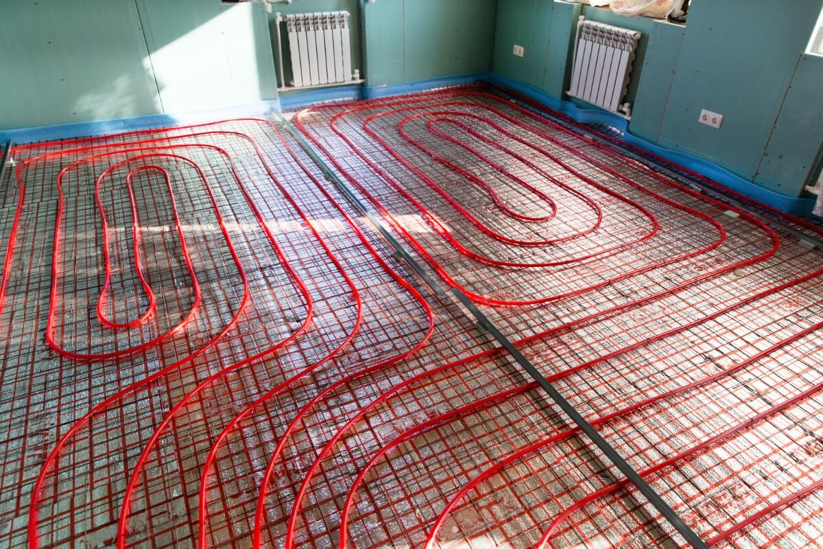 a heated floor in a room with red pipes