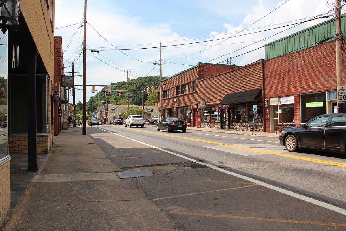a street with cars and buildings