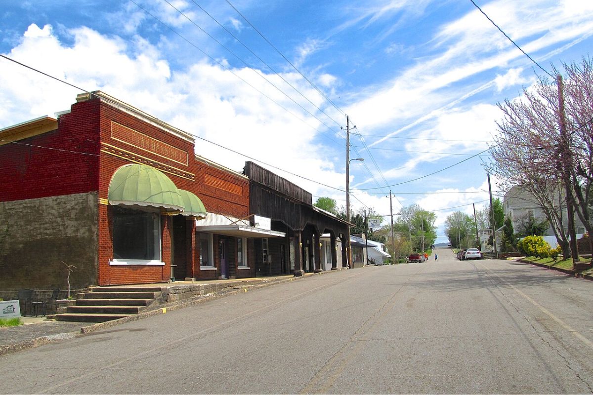 a street with buildings and cars