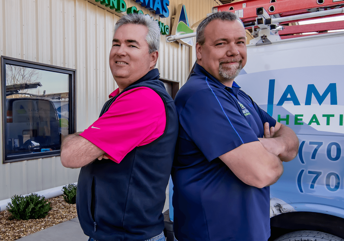 Two Man Standing outside of James THomas Heating & Cooling Office