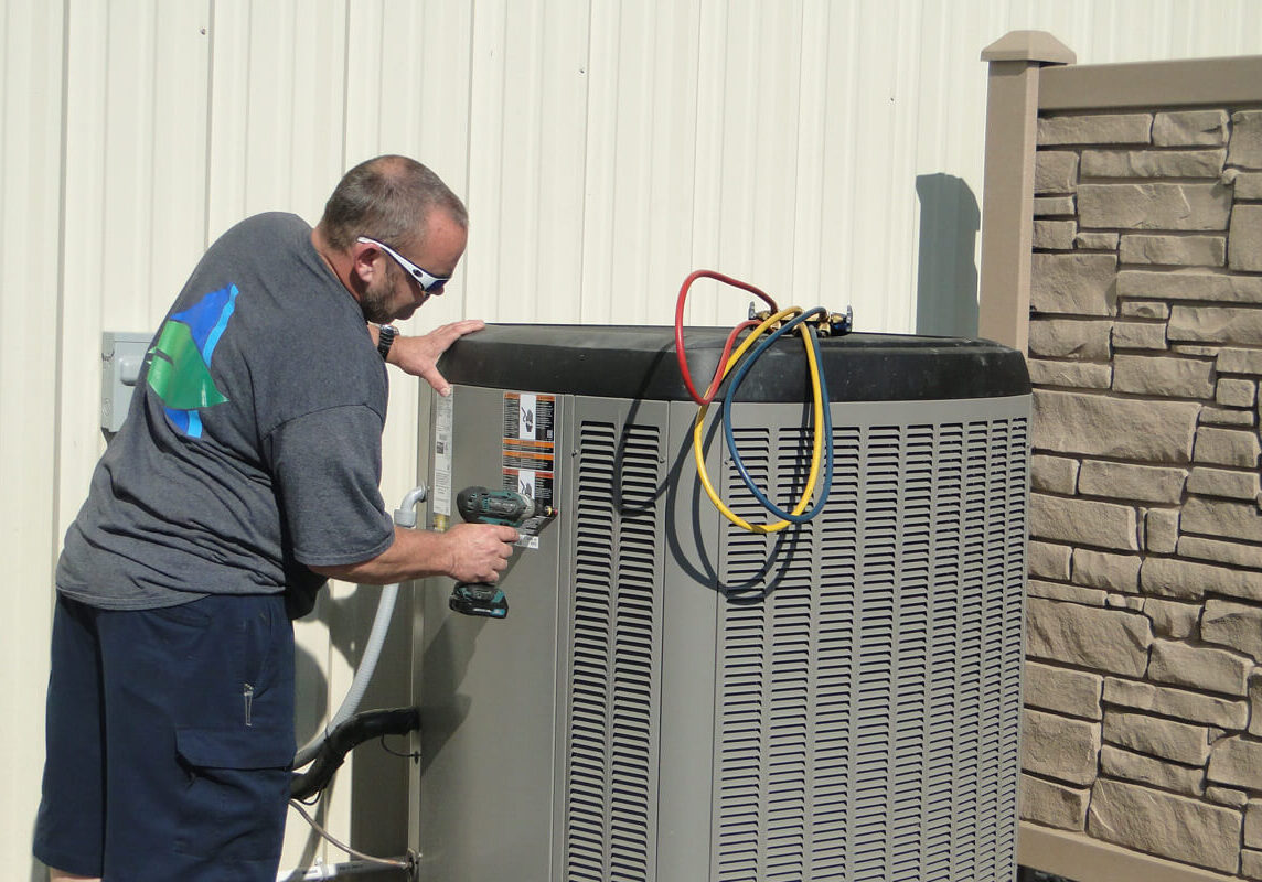Worker Working on Lennox Unit