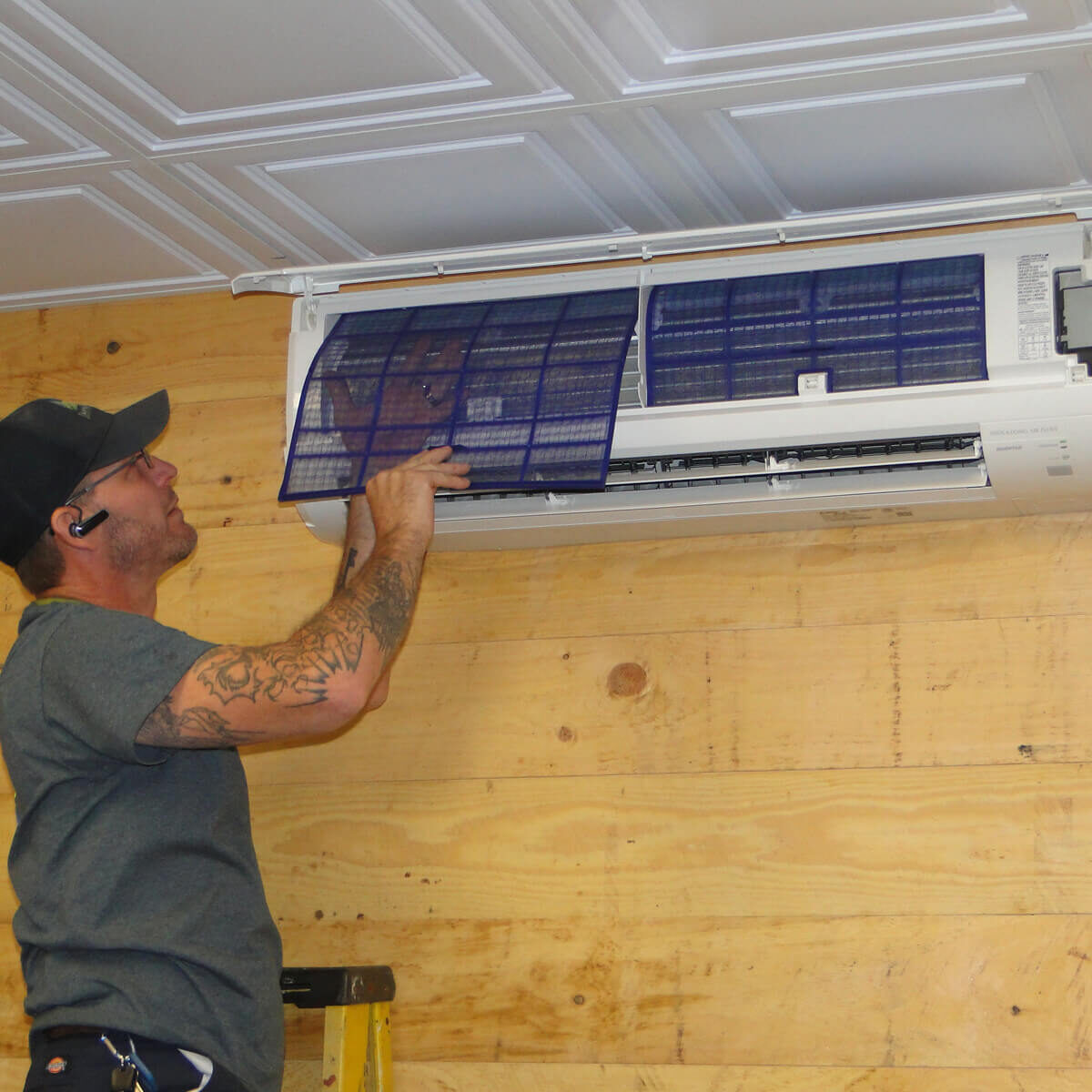 Worker working on Minisplit